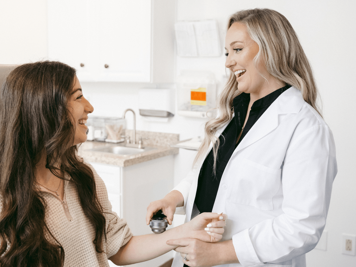 a dermatologist talking to her patient
