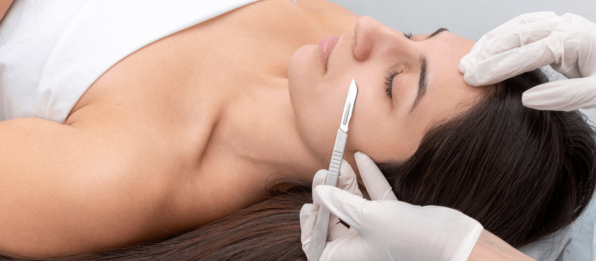 female getting a dermaplaning procedure