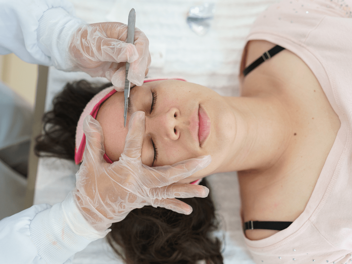 female getting dermaplaning procedure