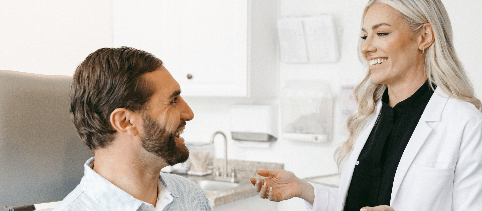 Dr. Hand in a dermatology consultation with a male patient.